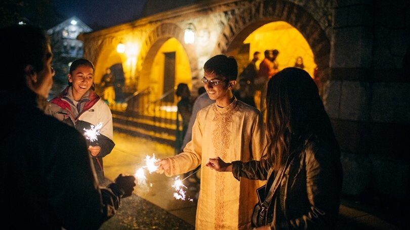 Students light candles