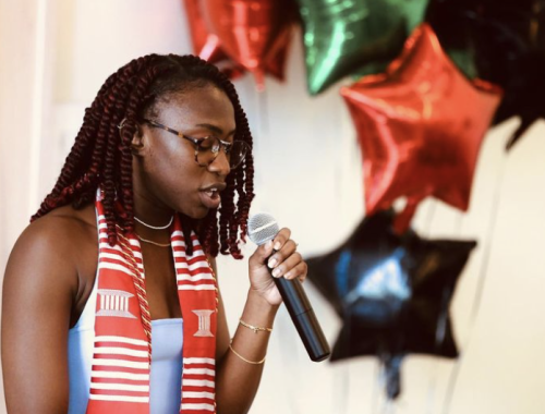 Woman speaking into a microphone