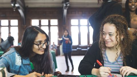 Two students work together on a project.