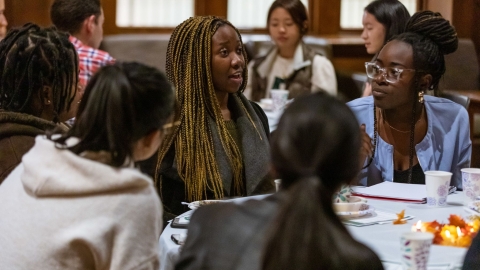 Students talk at a Tucker Center event.